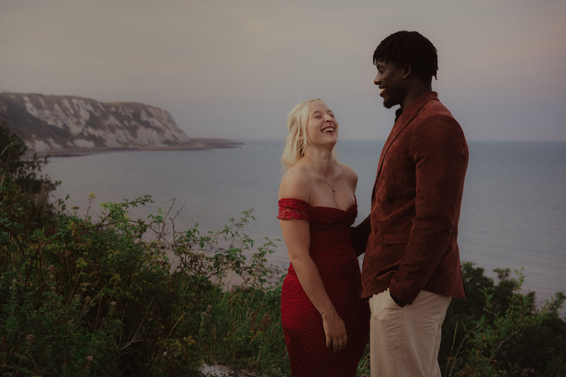 Saff and Bam laughing together at the coast