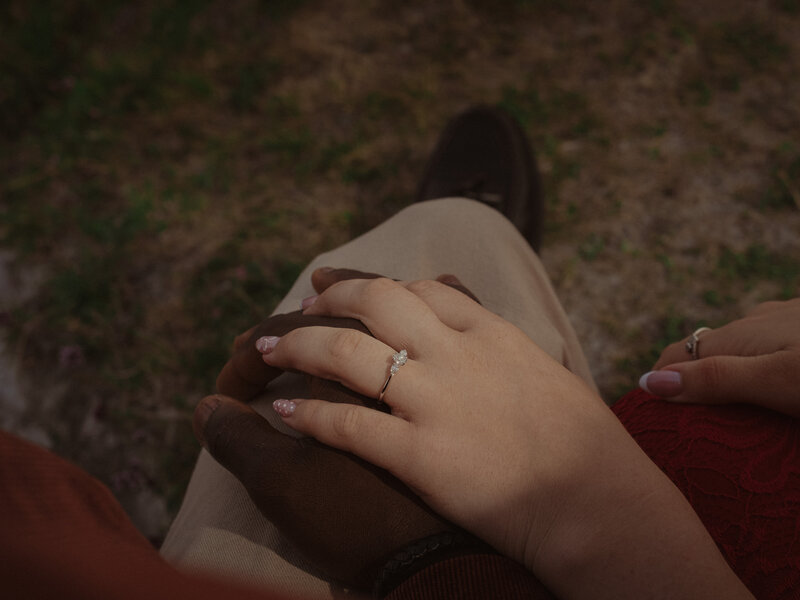 Saff and Bam holding hands, her ring visible